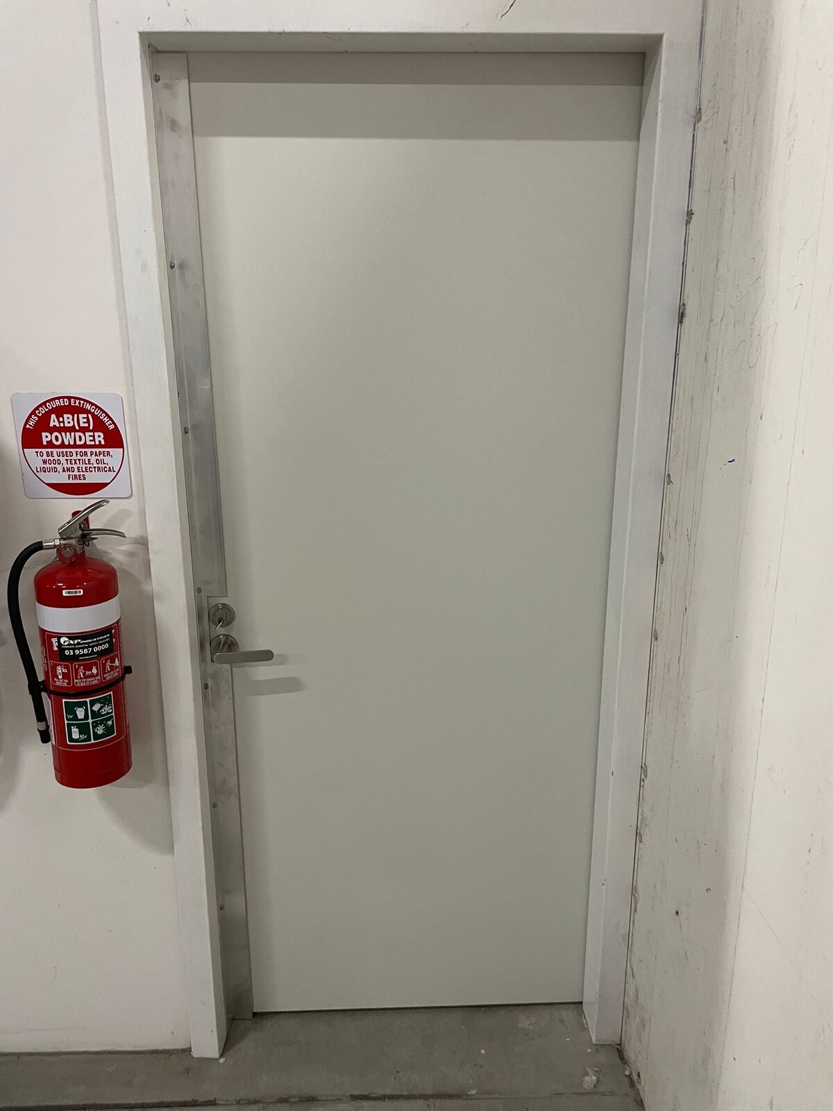 StormBloc Surf Mist external door installed at an Elwood property