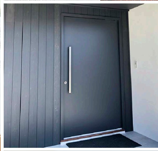 Charcoal lining board entrance door with a full-height stainless pull handle