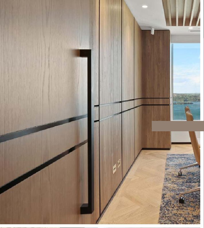 Timber joinery corridor with long matt black pulls